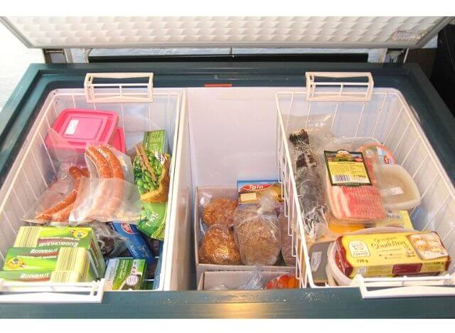 Neatly arrange the foods in chest freeze by tray