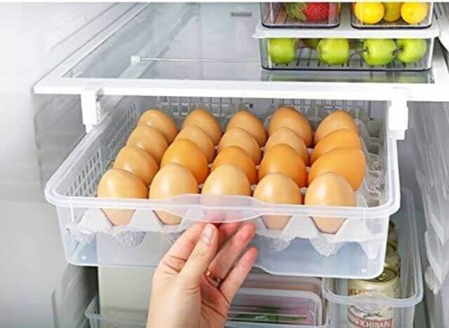 You should leave eggs in a container and storing them on the middle shelf of your fridge