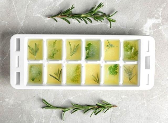 You can freeze herbs in the freezer with the ice tray without pre-drying