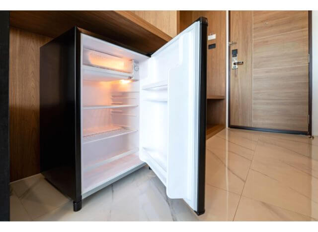 Mini refrigerators in hotel rooms make it easier to store food